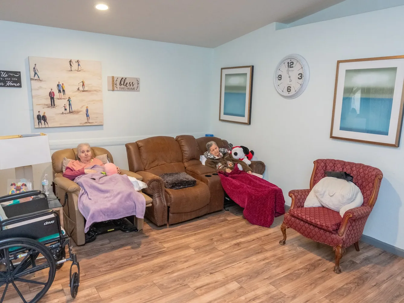 Residents enjoying leisure time in a spacious accessible common area.