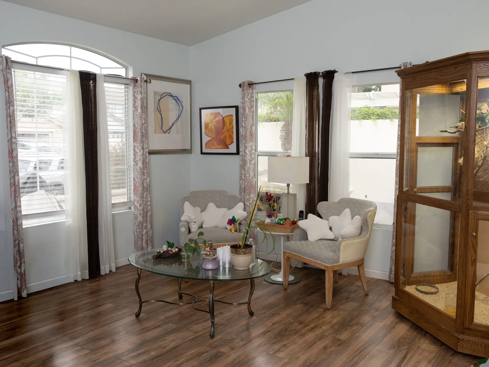 Comfortable living room area with upholstered seating and natural lighting.